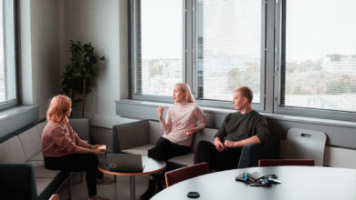 Team members engaged in a discussion about "What is AI orchestration?" and its impact on the role of AI orchestration in modern workflows